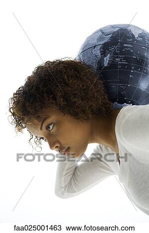 Young woman bending over, carrying globe on shoulders, side view View Large Photo Image Stock Image - Young woman bending over, carrying globe on shoulders, side view. Fotosearch