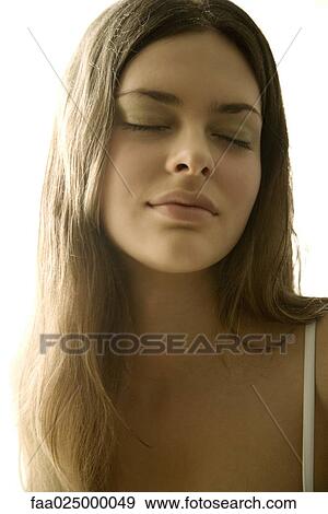 Young woman eyes closed, portrait, close-up View Large Photo Image Stock Photo - Young woman eyes closed, portrait, close-up. Fotosearch