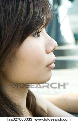 Young woman looking away, portrait, profile View Large Photo Image Stock Image - Young woman looking away, portrait, profile. Fotosearch