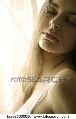 Young woman with droplets of water on shoulder, eyes closed, cropped view View Large Photo Image Stock Image - Young woman with droplets of water on shoulder, eyes closed, cropped view. Fotosearch