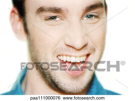 Stock Photograph - Man smiling, close-up, portrait. Fotosearch