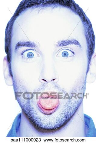 Man sticking out tongue, close-up, portrait View Large Photo Image Stock Image - Man sticking out tongue, close-up, portrait. Fotosearch
