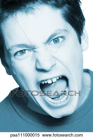 Stock Photography - Teenage boy shouting, close-up, portrait. Fotosearch