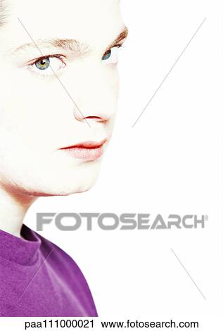 Stock Image - Teenage boy's face, close-up, portrait. Fotosearch