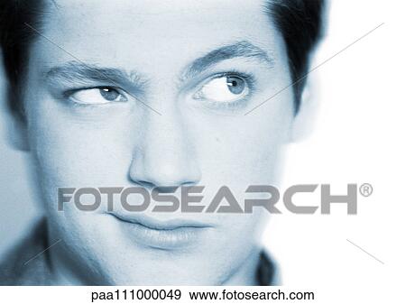 Stock Photo - Teenage boy's face, close-up, portrait. Fotosearch