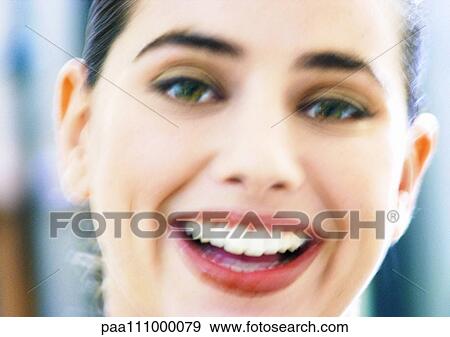 Woman smiling, close-up, blurred View Large Photo Image Stock Photo - Woman smiling, close-up, blurred. Fotosearch