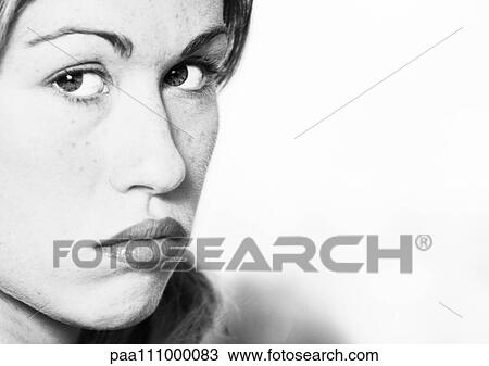 Stock Image - Woman's face, close-up, b&w. Fotosearch