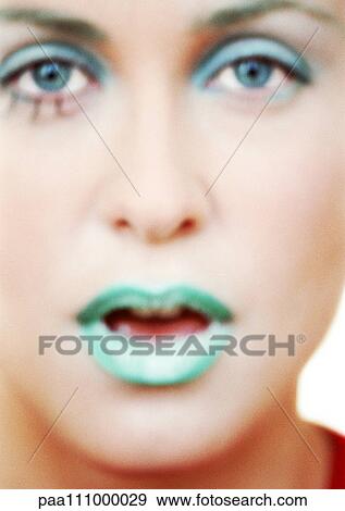 Woman's made-up face, close-up View Large Photo Image Stock Photo - Woman's made-up face, close-up. Fotosearch