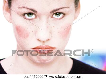 Young woman's face, wearing make-up, close-up, portrait View Large Photo Image Stock Photo - Young woman's face, wearing make-up, close-up, portrait. Fotosearch