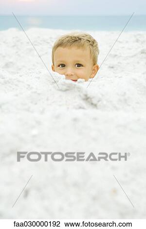 Boy's head emerging from sand, smiling at camera View Large Photo Image Stock Image - Boy's head emerging from sand, smiling at camera. Fotosearch
