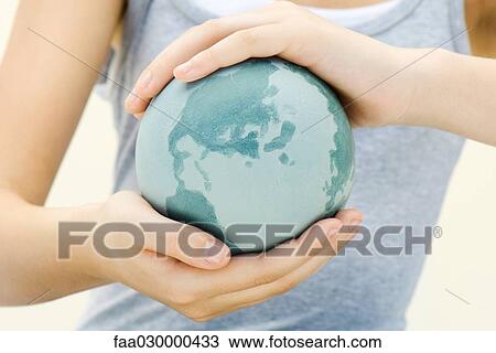 Child holding globe in hands, close-up View Large Photo Image Stock Image - Child holding globe in hands, close-up. Fotosearch
