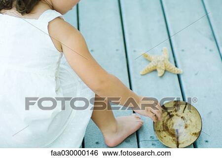 Child playing outdoors, cropped View Large Photo Image Stock Photograph - Child playing outdoors, cropped. Fotosearch
