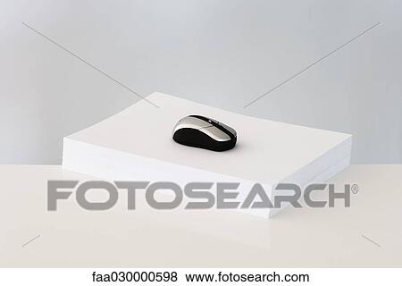 Computer mouse on top of stack of paper View Large Photo Image Stock Photo - Computer mouse on top of stack of paper. Fotosearch