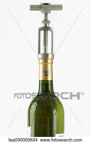 Corkscrew in wine bottle, close-up View Large Photo Image Picture - Corkscrew in wine bottle, close-up. Fotosearch