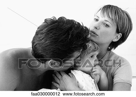 Stock Image - Couple with toddler, black and white. Fotosearch