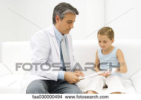 Doctor bandaging little girl's hand View Large Photo Image Picture - Doctor bandaging little girl's hand. Fotosearch