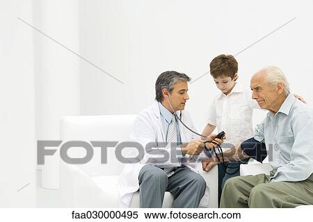 Doctor measuring elderly man's blood pressure, boy watching View Large Photo Image Stock Photography - Doctor measuring elderly man's blood pressure, boy watching. Fotosearch