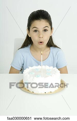 Girl blowing out candle on birthday cake, portrait View Large Photo Image Stock Image - Girl blowing out candle on birthday cake, portrait. Fotosearch
