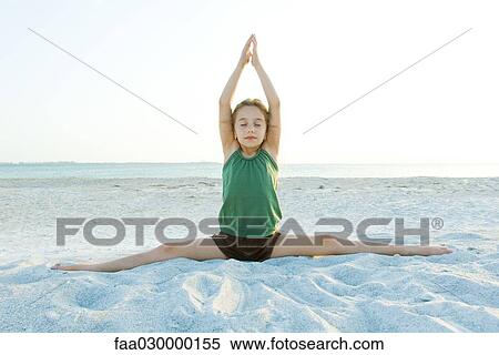 Girl doing yoga on beach View Large Photo Image Stock Photography - Girl doing yoga on beach. Fotosearch