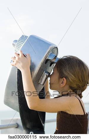 Girl looking through pay binoculars View Large Photo Image Stock Photography - Girl looking through pay binoculars. Fotosearch