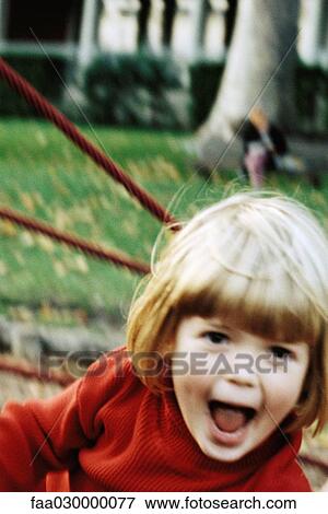 Girl on playground, making face at camera View Large Photo Image Stock Photo - Girl on playground, making face at camera. Fotosearch