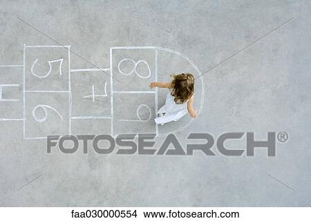 Girl playing hopscotch, overhead view View Large Photo Image Picture - Girl playing hopscotch, overhead view. Fotosearch