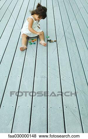 Girl playing on deck View Large Photo Image Stock Photo - Girl playing on deck. Fotosearch