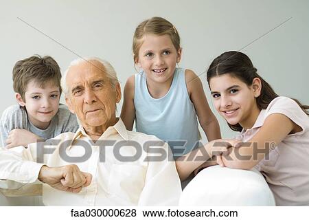 Grandfather and three grandchildren, all smiling, portrait View Large Photo Image Stock Photo - Grandfather and three grandchildren, all smiling, portrait. Fotosearch