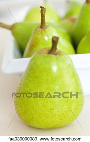 Green pears, close-up View Large Photo Image Stock Photo - Green pears, close-up. Fotosearch