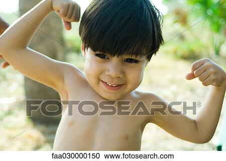 Little boy flexing muscles View Large Photo Image Stock Image - Little boy flexing muscles. Fotosearch