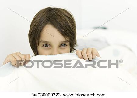 Little boy pulling sheet over his face, looking at camera View Large Photo Image Stock Image - Little boy pulling sheet over his face, looking at camera. Fotosearch