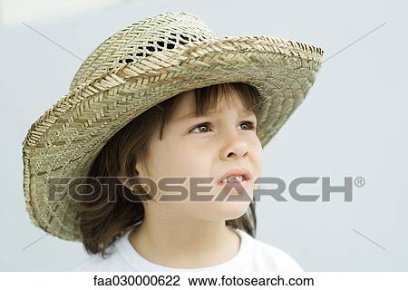 Little boy wearing straw hat, looking away, portrait View Large Photo Image Stock Image - Little boy wearing straw hat, looking away, portrait. Fotosearch