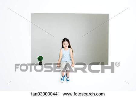 Little girl sitting on ledge, next to plant View Large Photo Image Stock Image - Little girl sitting on ledge, next to plant. Fotosearch