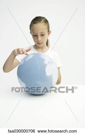 Little girl touching globe with finger View Large Photo Image Stock Photograph - Little girl touching globe with finger. Fotosearch