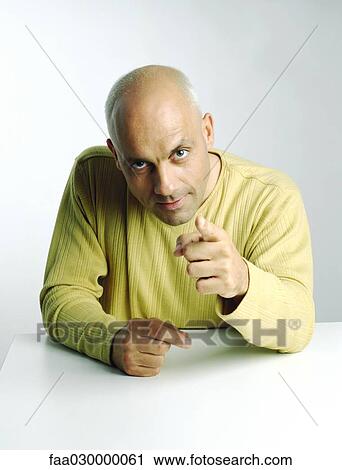 Man pointing at camera, portrait View Large Photo Image Stock Image - Man pointing at camera, portrait. Fotosearch