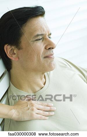 Man with woman's hand on his shoulder, looking away, cropped view View Large Photo Image Stock Photo - Man with woman's hand on his shoulder, looking away, cropped view. Fotosearch