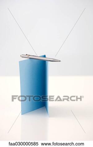 Pen balanced on folded card View Large Photo Image Stock Photography - Pen balanced on folded card. Fotosearch