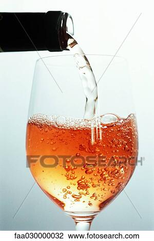 Rose wine being poured View Large Photo Image Stock Image - Rose wine being poured. Fotosearch