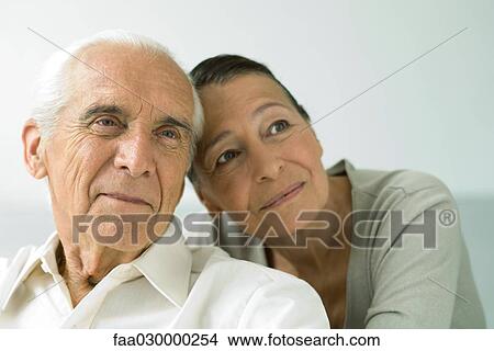 Senior couple together, smiling, looking away View Large Photo Image Picture - Senior couple together, smiling, looking away. Fotosearch