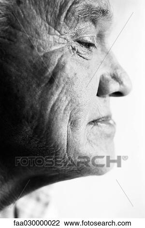 Senior man, smiling and looking down, side view of face, black and white View Large Photo Image Stock Image - Senior man, smiling and looking down, side view of face, black and white. Fotosearch