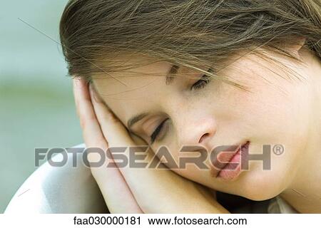 Teenage girl resting head on hands, close-up View Large Photo Image Stock Image - Teenage girl resting head on hands, close-up. Fotosearch