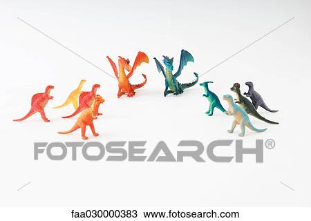 Toy dinosaurs and dragons arranged by color, close-up View Large Photo Image Stock Image - Toy dinosaurs and dragons arranged by color, close-up. Fotosearch