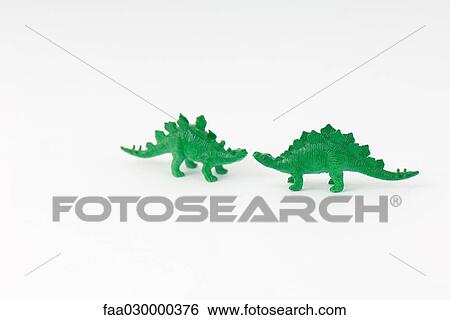 Two toy dinosaurs, face to face View Large Photo Image Stock Photograph - Two toy dinosaurs, face to face. Fotosearch