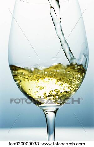 White wine being poured View Large Photo Image Stock Image - White wine being poured. Fotosearch