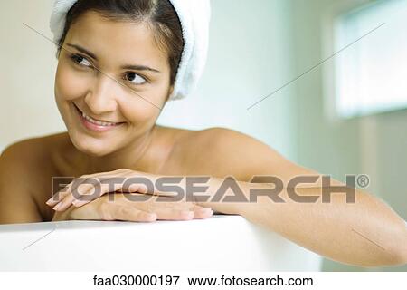 Woman in bathtub, wearing shower cap, smiling View Large Photo Image Stock Photo - Woman in bathtub, wearing shower cap, smiling. Fotosearch