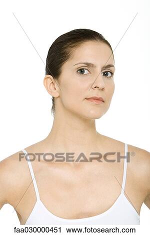 Woman in tank top looking at camera, portrait View Large Photo Image Stock Image - Woman in tank top looking at camera, portrait. Fotosearch