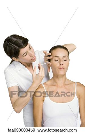 Woman receiving botox injection, eyes closed View Large Photo Image Stock Photo - Woman receiving botox injection, eyes closed. Fotosearch