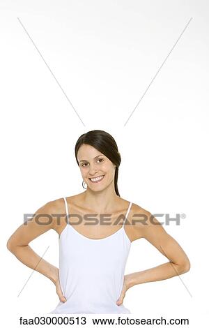 Woman smiling at camera, hands on hips, portrait View Large Photo Image Stock Image - Woman smiling at camera, hands on hips, portrait. Fotosearch