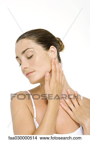 Woman touching neck, eyes closed View Large Photo Image Picture - Woman touching neck, eyes closed. Fotosearch