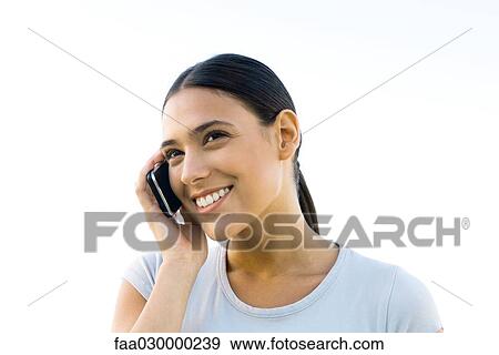 Woman using cell phone, smiling View Large Photo Image Stock Photo - Woman using cell phone, smiling. Fotosearch